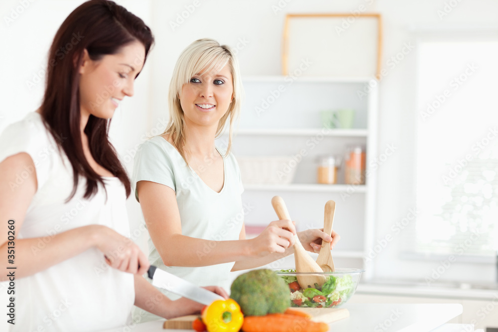 Cheerful Women preparing dinner