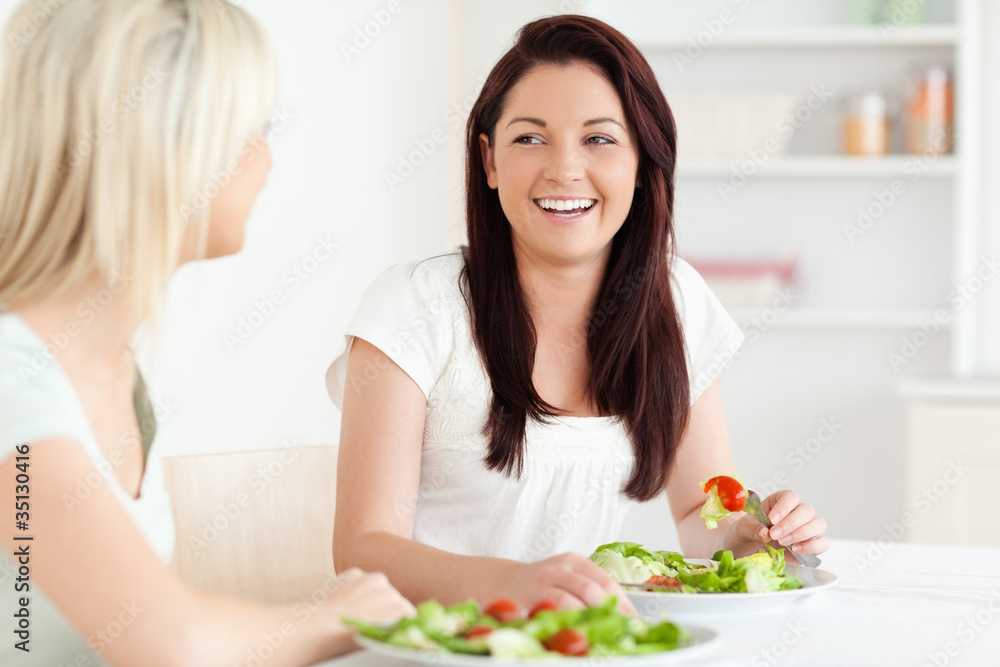 Portrait of laughing Women eating salad