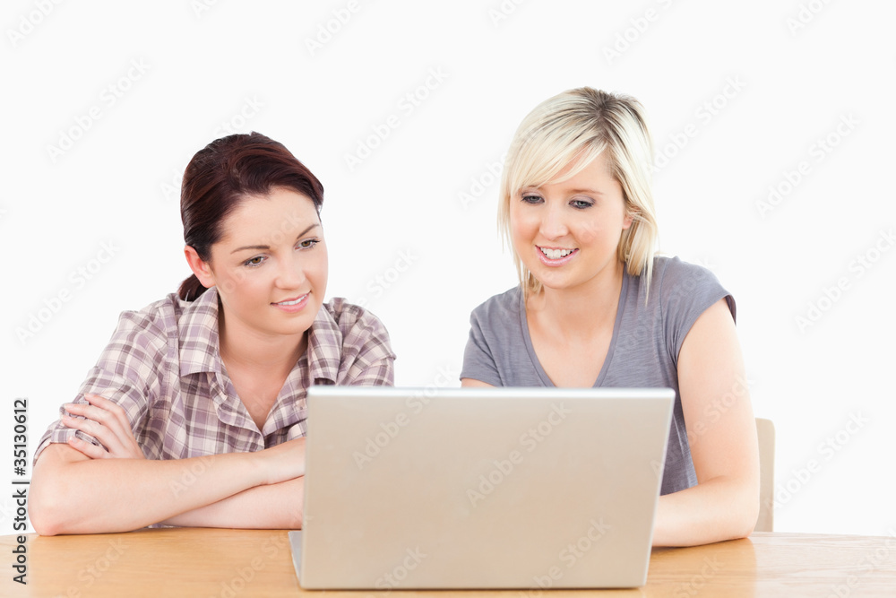 Gorgeous women learning with notebook and books Gorgeous women learning with notebook and books
