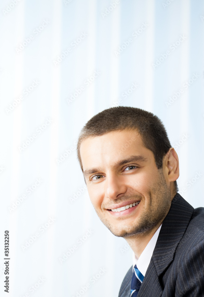 Portrait happy smiling business man at office Portrait happy smiling business man at office