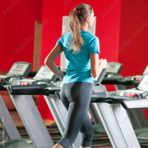 Gym exercising. Run on on a machine.