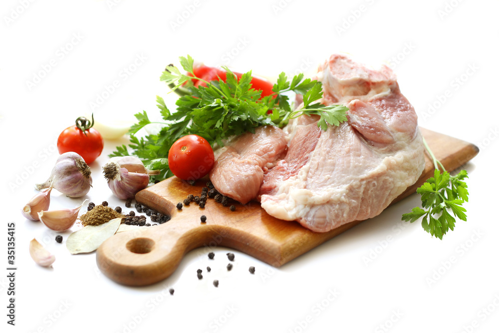raw meat and different spices on wooden cutting board raw meat and different spices on wooden cutting board