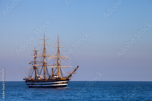 A beautiful three-masted sailboat in the sea