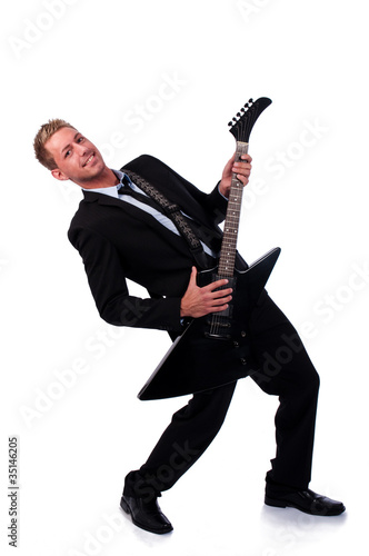 Businessman with electronic guitar