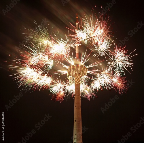 Biggest basket in the world on TV tower and fireworks. photo