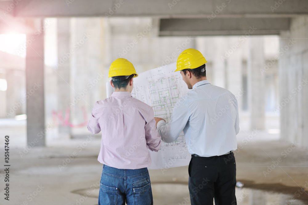 Team of architects on construciton site Team of architects on construciton site
