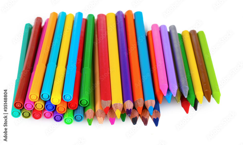 Bright markers and crayons isolated on white Bright markers and crayons isolated on white