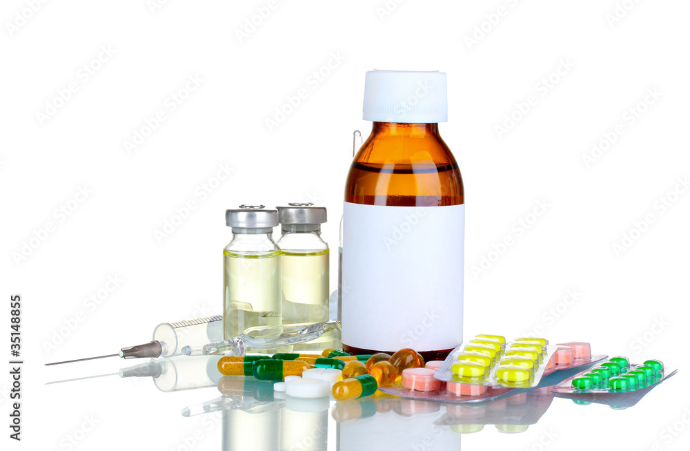 Medical bottles, ampoule, syringe and pills isolated on white Medical bottles, ampoule, syringe and pills isolated on white