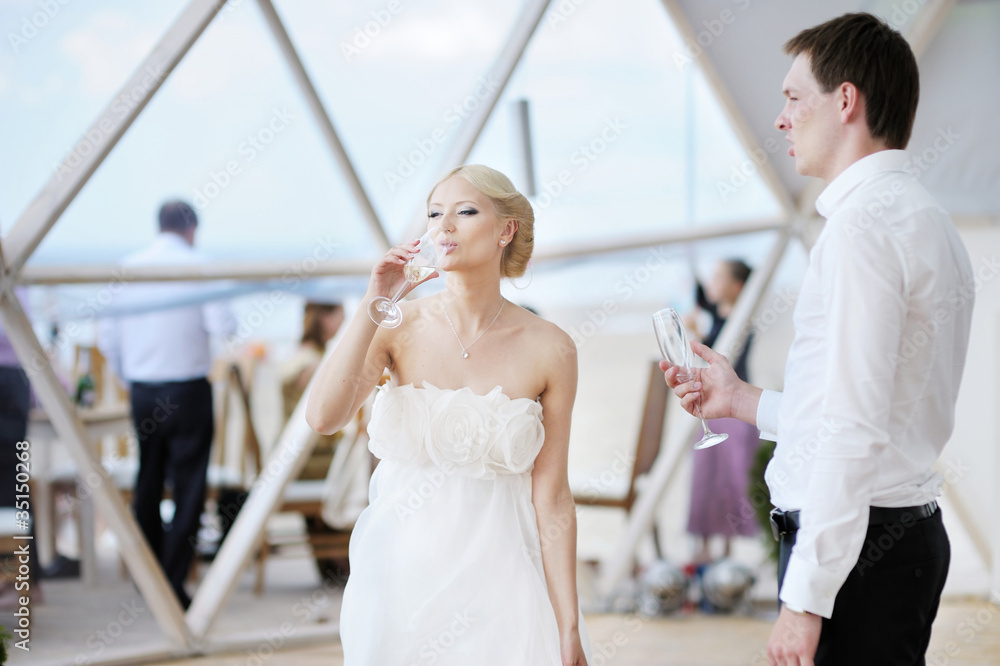 Beautiful young bride and groom outdoors