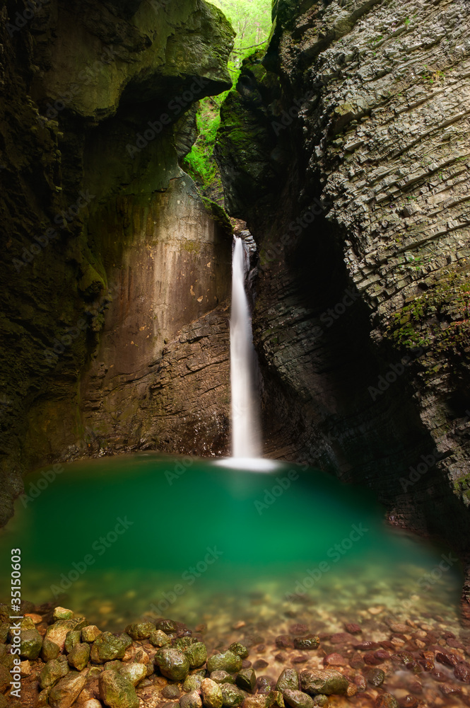 Beautiful waterfall in a cave. Kozjak, Alpine Slovenia Stock Photo