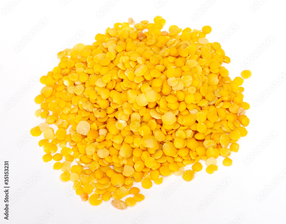 Yellow lentils isolated on white background.Macro shot Yellow lentils isolated on white background.Macro shot
