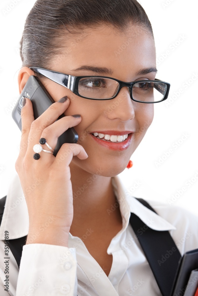 Beautiful businesswoman on mobile phone smiling Beautiful businesswoman on mobile phone smiling