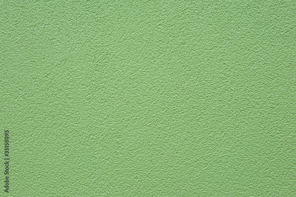 Fototapeta premium Grain green paint stucco wall texture bakground