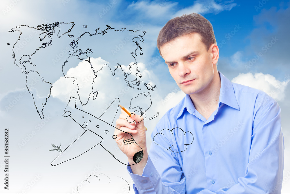 Businessman drawing plane and world map Businessman drawing plane and world map