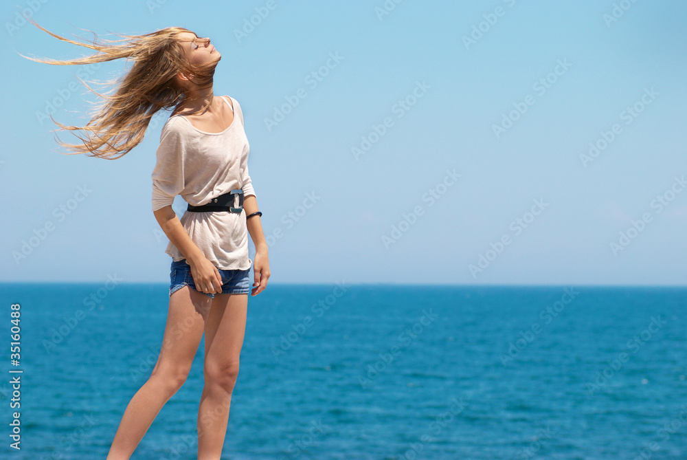 Naklejka premium Pretty blond girl outdoors