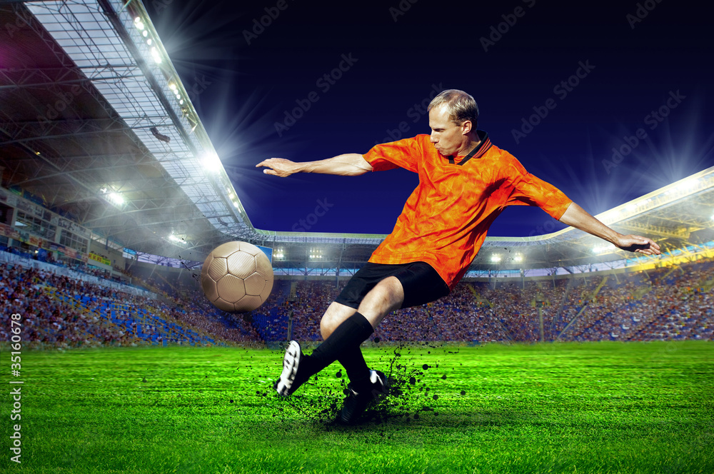 Naklejka premium Football player on field of stadium