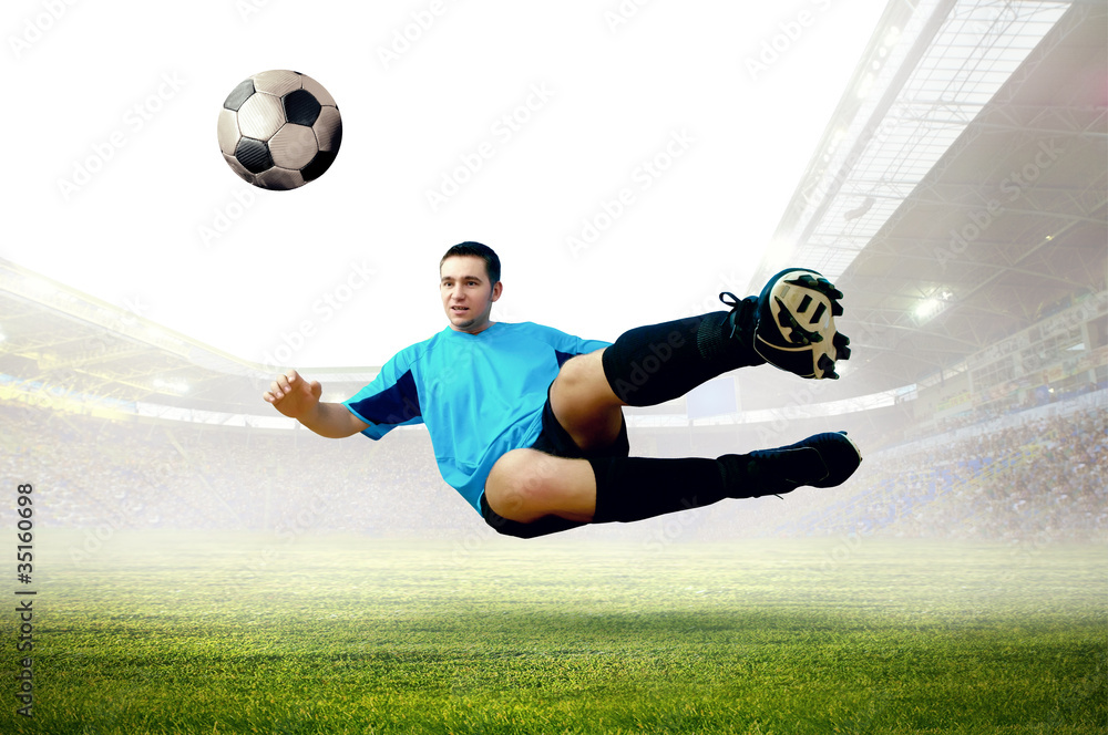 Naklejka premium Football player on field of stadium
