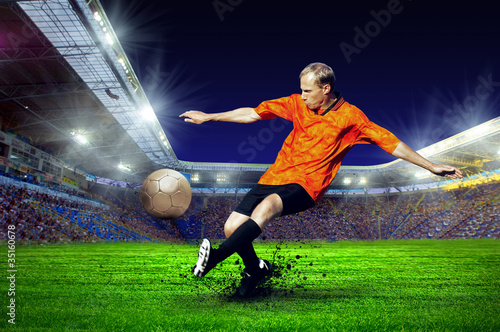 Football player on field of stadium © Andrii IURLOV