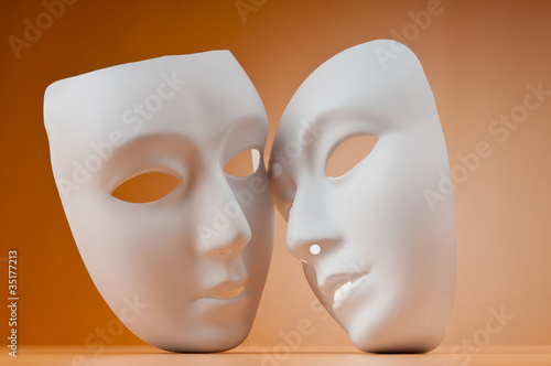 Theatre concept with masks against background