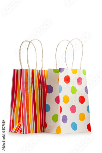 Colourful paper shopping bags isolated on white