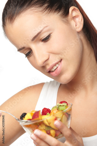woman eating fruit salad
