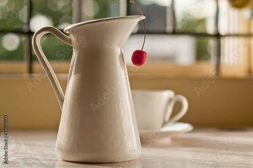 Cherry Hanging from a vase