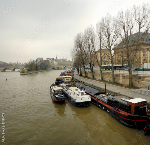 paris with the river seine , barge, ship, bridge, island, qua