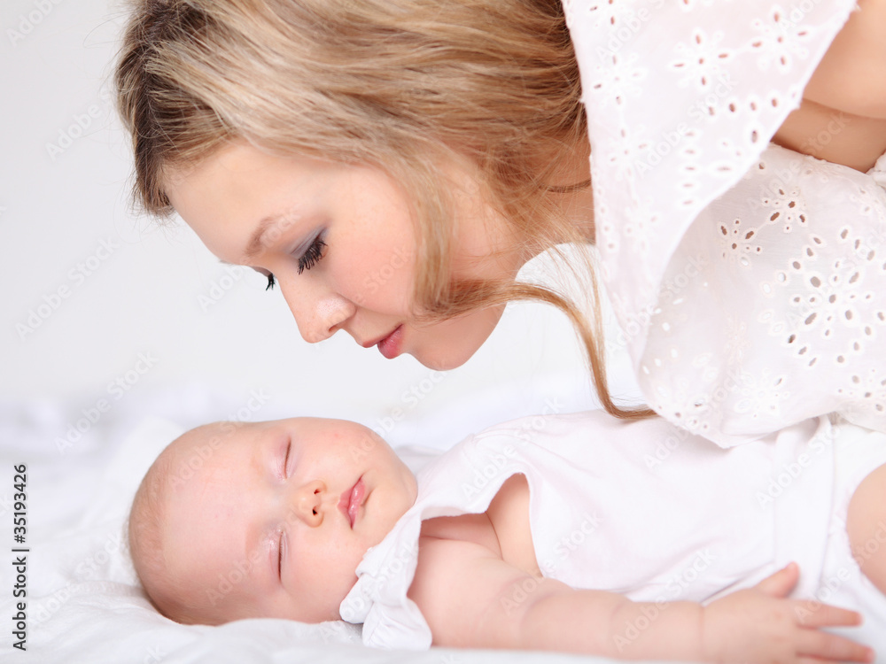 Portrait of a young mother and baby Portrait of a young mother and baby