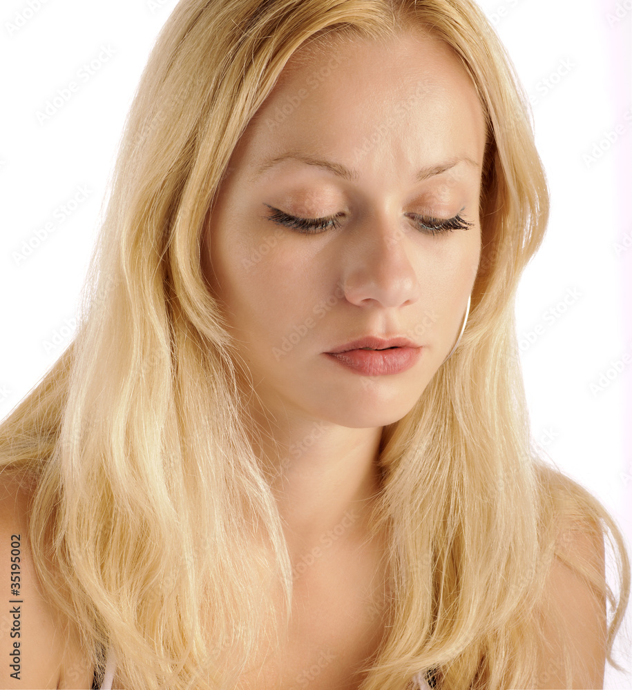 Pretty girl with long eyelashes looking down Pretty girl with long eyelashes looking down
