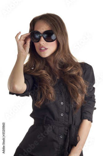 Young model with sunglasses posing