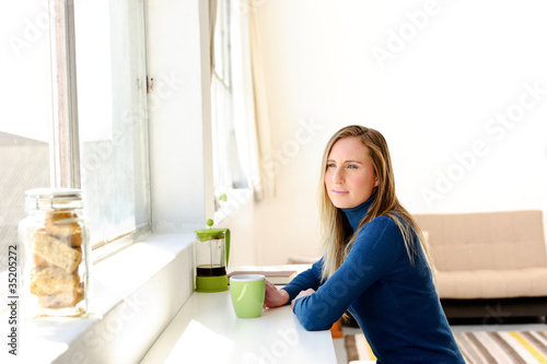 Thoughtful woman with coffee