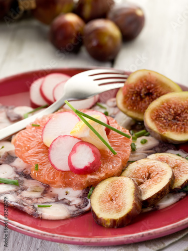 octopus carpaccio over grapefruit with figs and  radish