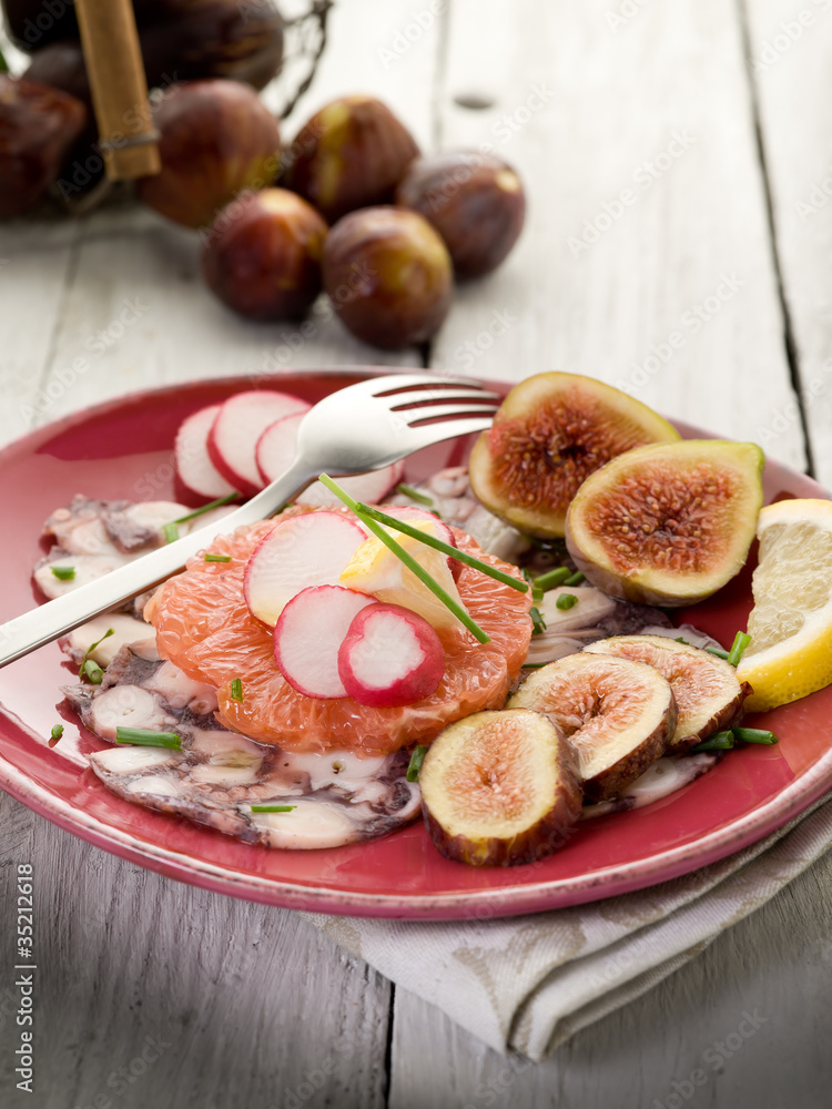 octopus carpaccio over grapefruit with figs and radish octopus carpaccio over grapefruit with figs and radish