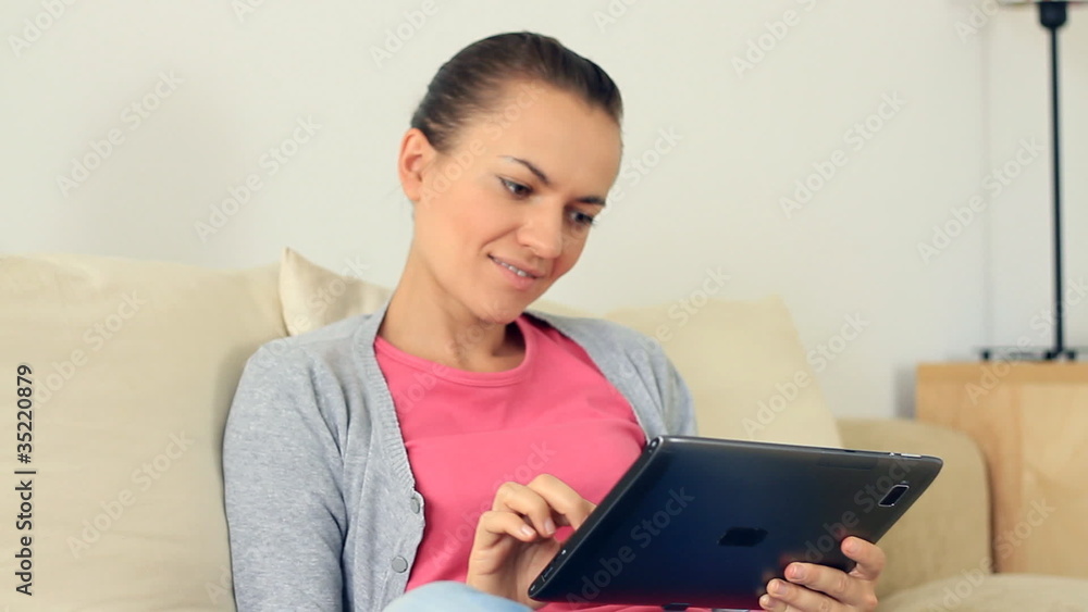 Young woman with digital tablet sitting on the floor, steadicam Young woman with digital tablet sitting on the floor, steadicam