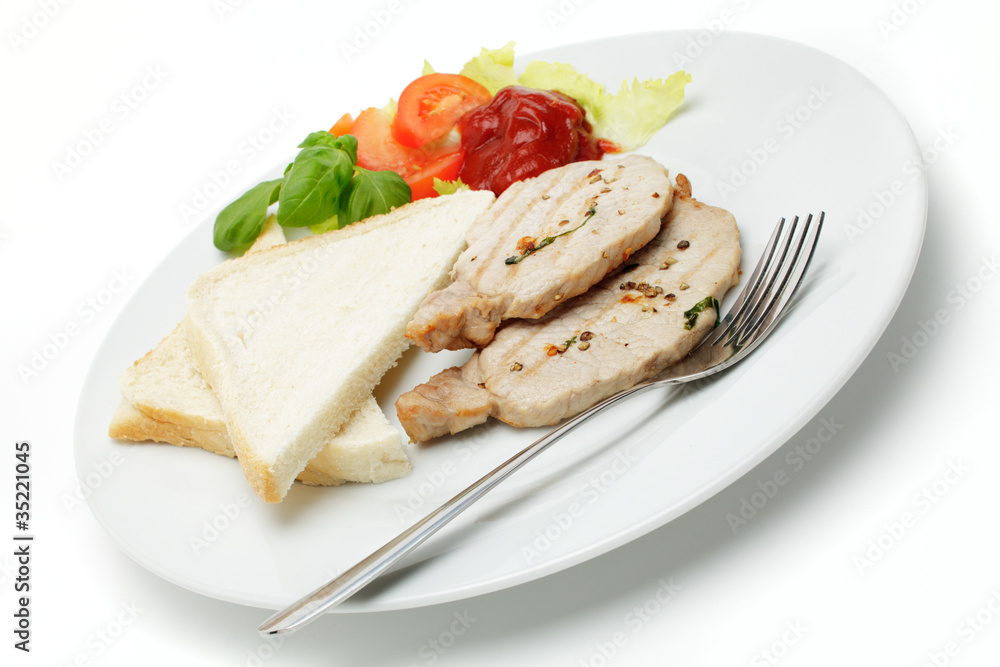 Gegrillte Schweinerückensteaks an Toastbrot Gegrillte Schweinerückensteaks an Toastbrot