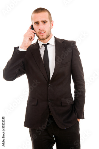 young business man talking on mobil phone, isolated on white