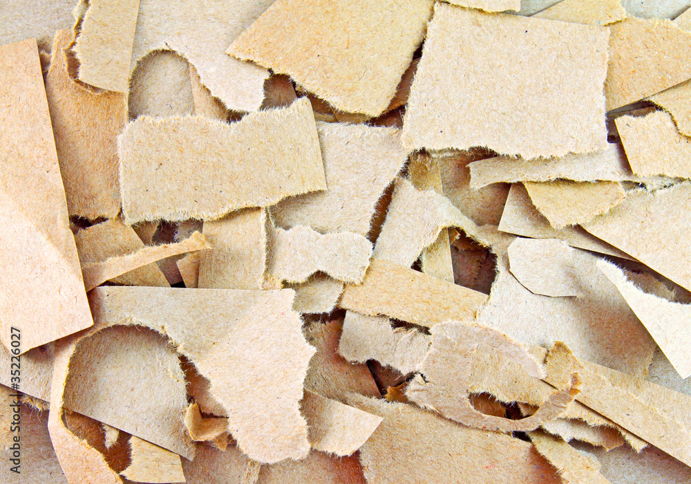 Close up of torn pieces of brown paper Close up of torn pieces of brown paper