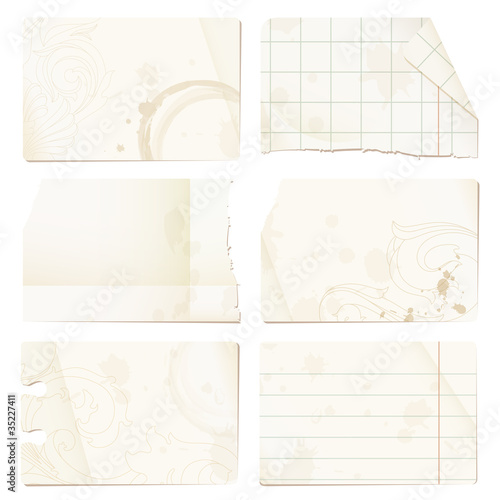 Old paper sheets - checked, lined, stained, with ornaments