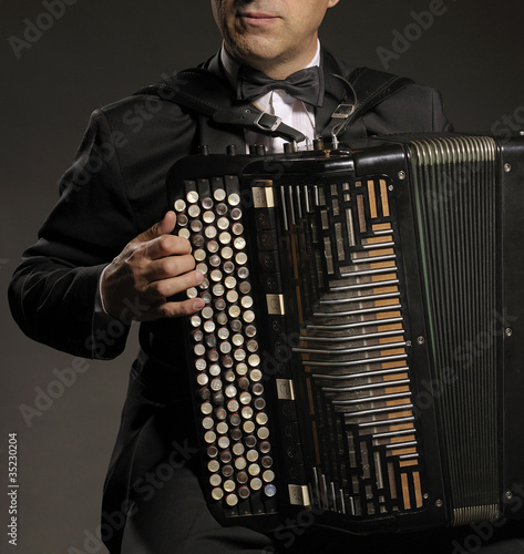 A man playing the accordion