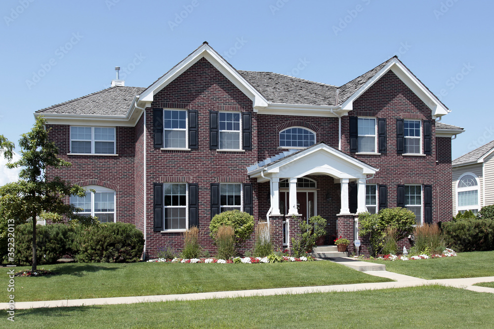 Large brick home with arched entry Large brick home with arched entry
