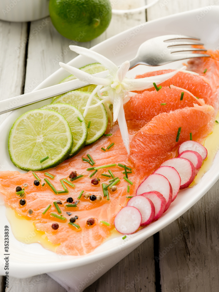 salmon carpaccio with slice grapefruit, lime and radish salmon carpaccio with slice grapefruit, lime and radish