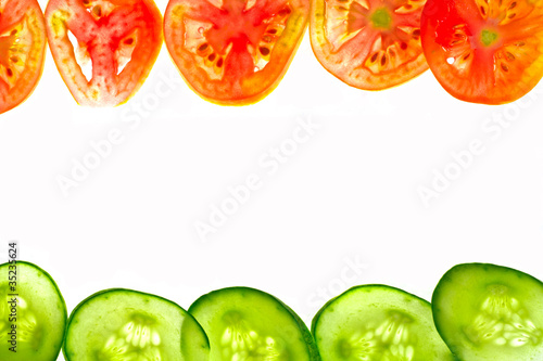 Pieces of sliced tomato and cucumber frame