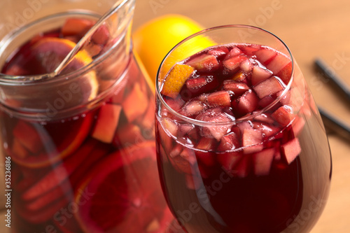 Fotografie, Obraz Red wine punch called sangria with orange, apple, mango