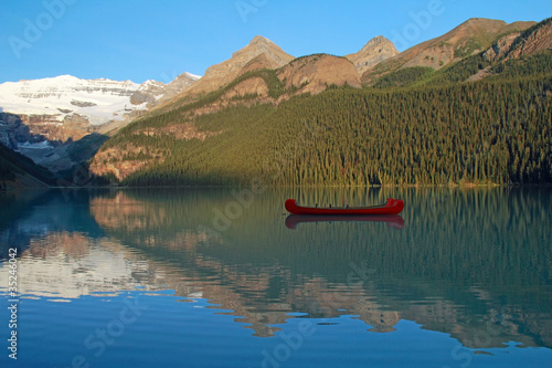Red Voyageur Canoes on L. Louise at Dawn - Banff NP, Canada