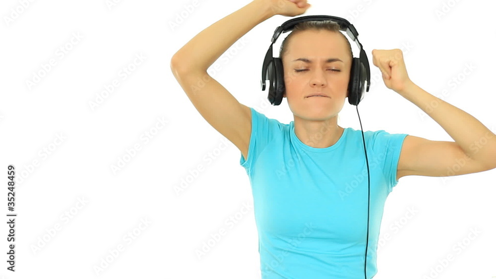 Young woman with headphones dancing, isolated on white Young woman with headphones dancing, isolated on white