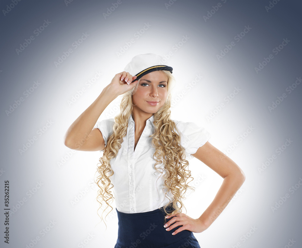 Sexy female sailor on a grey background