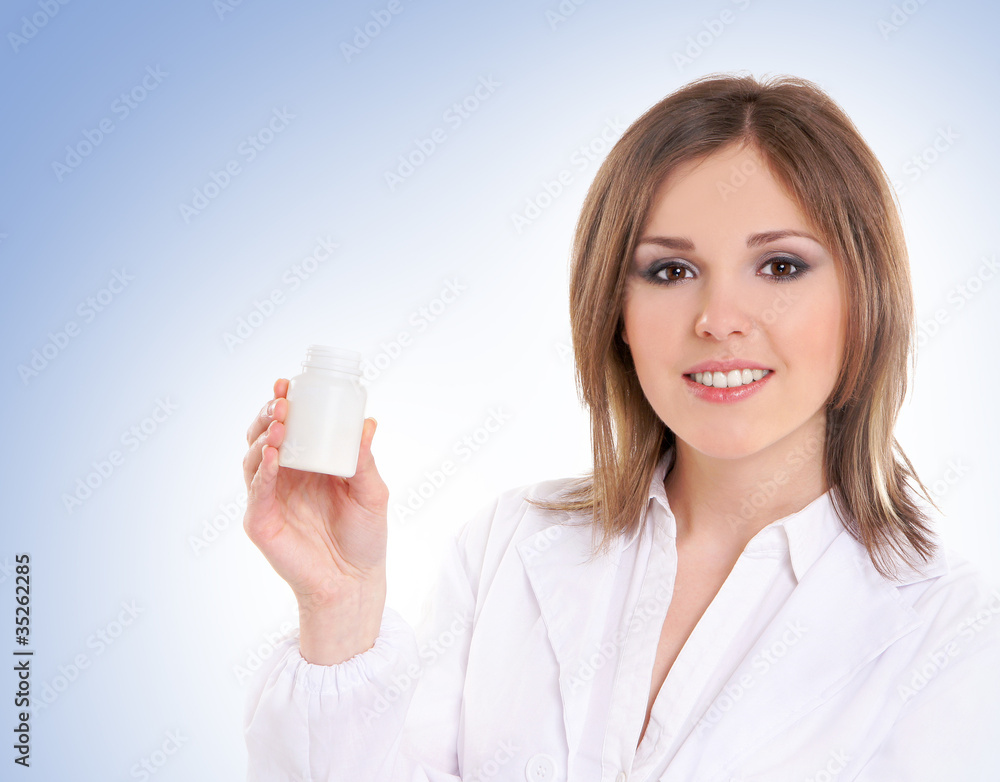 Young attractive doctor isolated over blue background Young attractive doctor isolated over blue background
