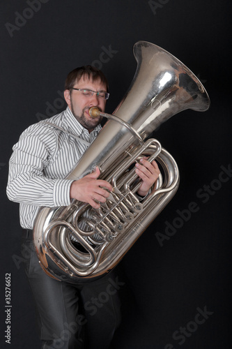 man playing a tuba photo