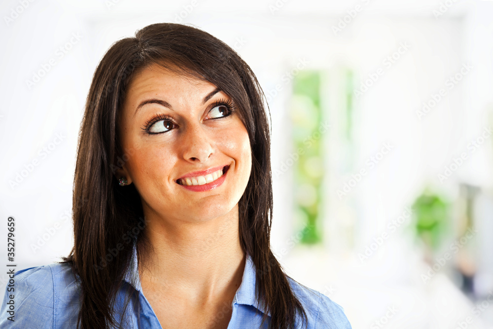 Smiling businesswoman having an idea Smiling businesswoman having an idea