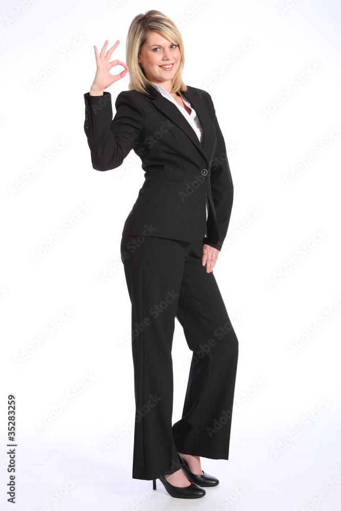 Okay sign by happy young blonde business woman